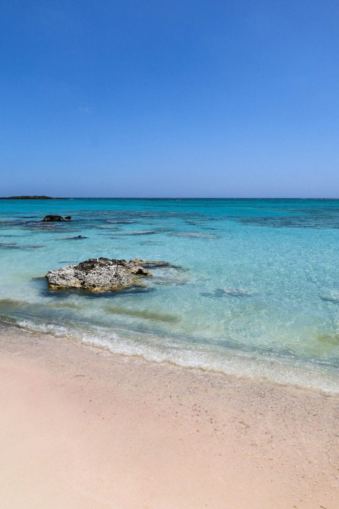 Experience the turquoise waters and sandy shores of Elafonisi Beach, a famous location in Crete, Greece.